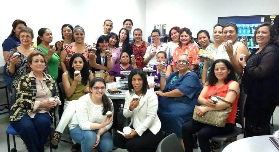 A group of Life Asset entrepreneurs celebrates a completed training class with cupcakes
