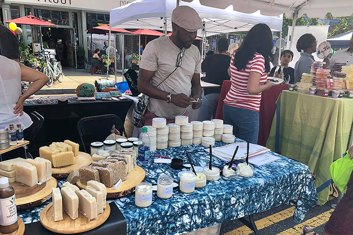 An entrepreneur sells his wares at a street fair
